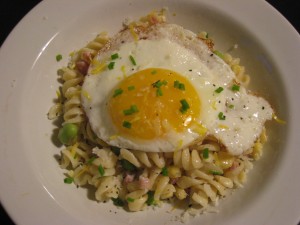 Annie's organic four-cheese pasta with pancetta, corn, edamame and fried egg